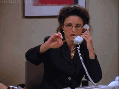 Elaine from Seinfeld on phone while doing rubber pencil trick.