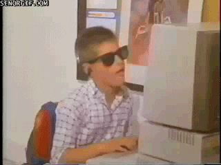 kid rocking out in front of old PC