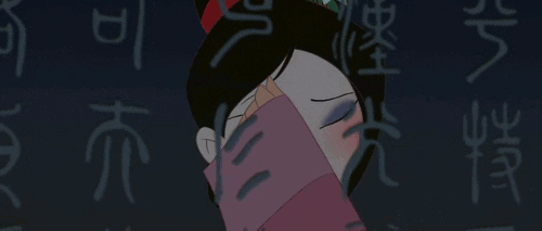 [Image description: Mulan sings while rubbing off her makeup.] via Giphy