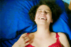 Broad City Ilana laughing in bed 
