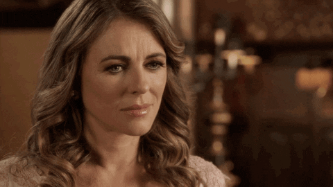 Liz Hurley Shrug GIF by The Royals on E! - Find & Share on GIPHY