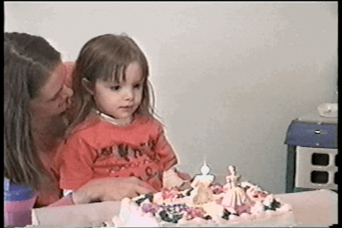 Kid blowing candles