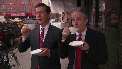 Steven Colbert and Jon Stewart drinking coffee