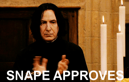 Snape clapping in approval.