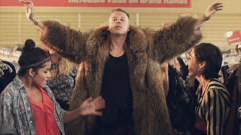 Rapper Macklemore dances in a thrift shop