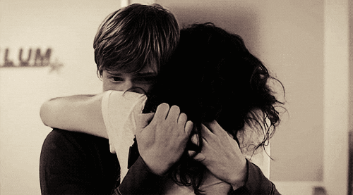 Black And White Showtime GIF Find Share On GIPHY girl-smiles-and-looks-off-into-the-distance-while-the-guy-is-hugging