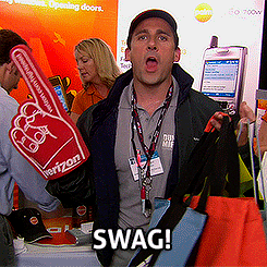 The Office's Michael Scott, at a conference, getting excited about conference swag.