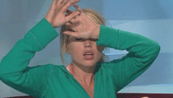 Reaction GIF of exasperated frustrated woman doing a facepalm