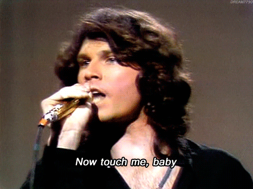 Jim Morrison from the band 'The Doors' singing