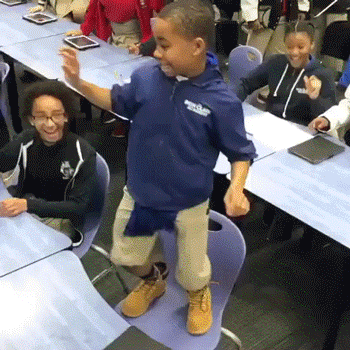Gif of a student dancing on a chair.