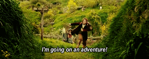 Bilbo Baggins from "The Hobbit" runs through a field towards the camera, shouting "I'm going on an adventure!"