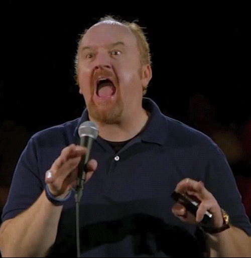 Louis CK mimeing typing with mouth open
