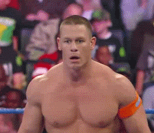 A gif of a wrestler looking extremely stunned
