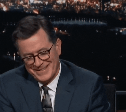 Stephen Colbert tapping on his watch