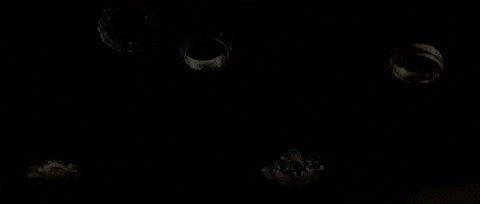 A gif of multiple rings floating into water.