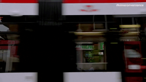 TTC Streetcar passing by Convenience Store