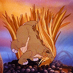 Spike, a baby Stegosaurus from the movie The Land Before Time, munching away on long grasses.