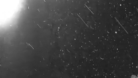 Snow storm on comet Chury seen by Rosetta spacecraft gif