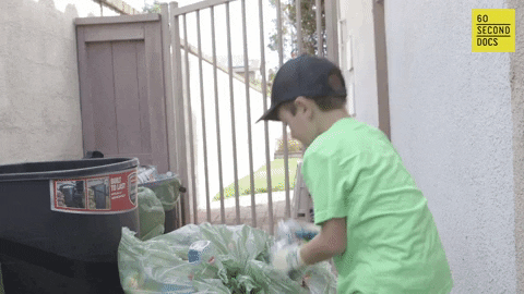 boy cleaning the trash