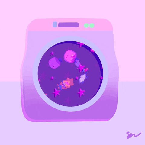 Gif of a purple washing machine with a solar system flying around inside it.