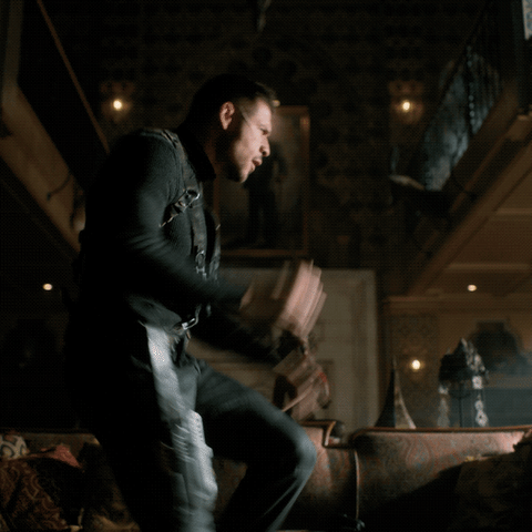Diego Hargreeves (David Castaneda) dancing, high-energy-style, in the living room of the family mansion