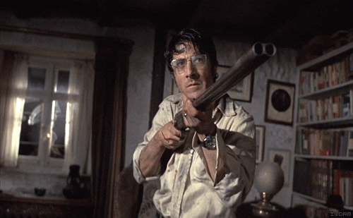 GIF of Dustin Hoffman shaking his head with a shotgun.