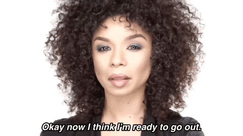 [Gif via Giphy description: a black woman touching her curls saying "Okay now I think I'm ready to go out."]