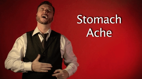 A man gesturing a stomach ache
