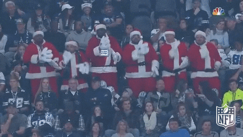 Guys Dancing in Santa Suits