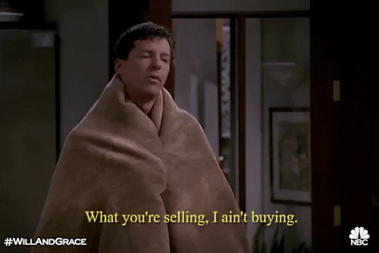 Jack McFarland from Will and Grace is wrapped in a blanket and telling someone out of the image, "What you're selling, I ain't buying. Just like a No Gifts Christmas! 