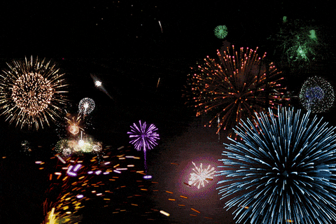Many fireworks in the night sky.