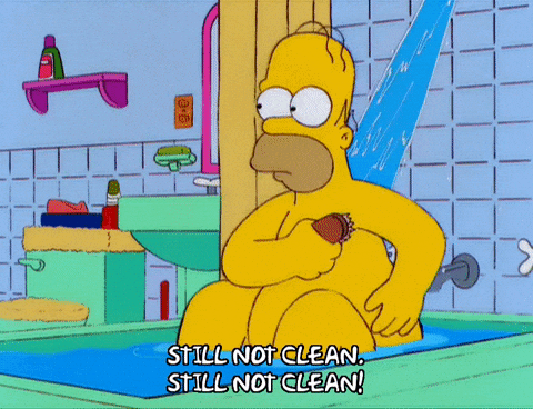 Gif of Homer from The Simpsons scrubbing himself in the bath tub, with the catchphrase: "Still not clean!"