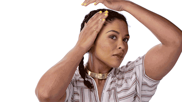 a GIF of a woman setting her two plaits 