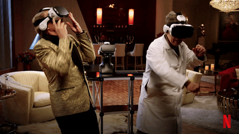 gif homens jogando videogame com óculos de realidade virtual