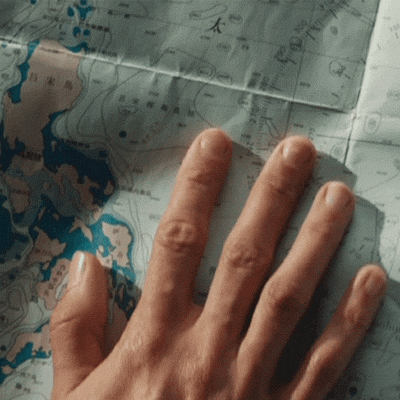 hand pointing the map