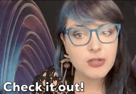 GIF of woman in blue glasses saying "Check it out!"