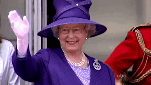 Queen Elizabeth II Waving While Wearing a Purple Hat