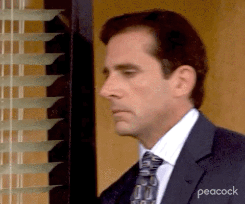 An office worker putting his face in his hand