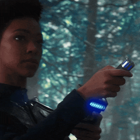 Star Trek's Captain Michael Burnham, scanning the area. Caption below: Oh hello.