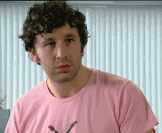 GIF of character from the IT Crowd looking scared and backing away.