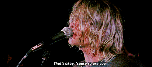 Gif with Kurt Cobain of Nirvana singing 'that's okay, because so are you' from the song Lithium.