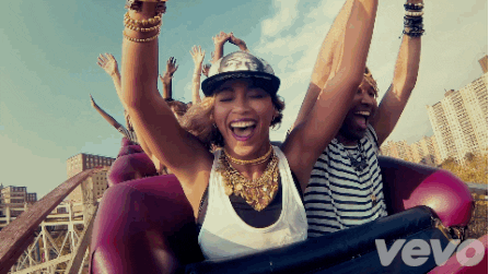 Beyoncé, a woman riding on top of a roller coaster at a Quinceanera celebration
