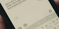 Person anxiously checking their phone over and over, waiting for a notification