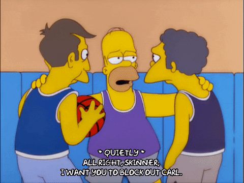 Homer simpson in basketball gear huddling with skinner and moe