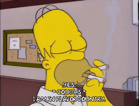 Homer Simpson fumando y tosiendo, el tabaco como factor de riesgo de muchas enfermedades. 