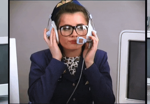 Flight attendant fixing her headset frustratingly