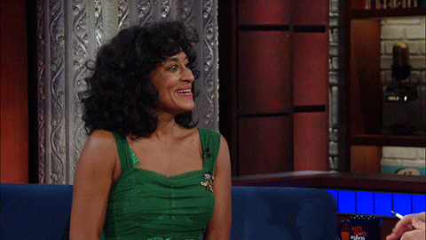 a GIF of Tracee Ellis Ross smiling, showing her Type 3 hair (3b)