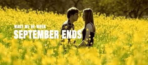 A young man and woman kissing in a field. It's all very cinematic. Caption: Wake Me Up When September Ends