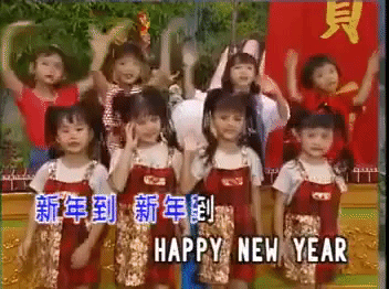 kids dressed up in red dancing and singing to happy chinese new year song music