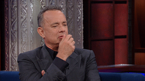 American actor, Tom Hanks, thinking and moving his hand over his mouth